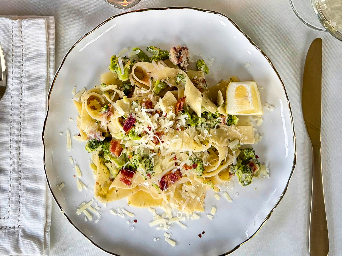 White plate with a pasta dish on top
